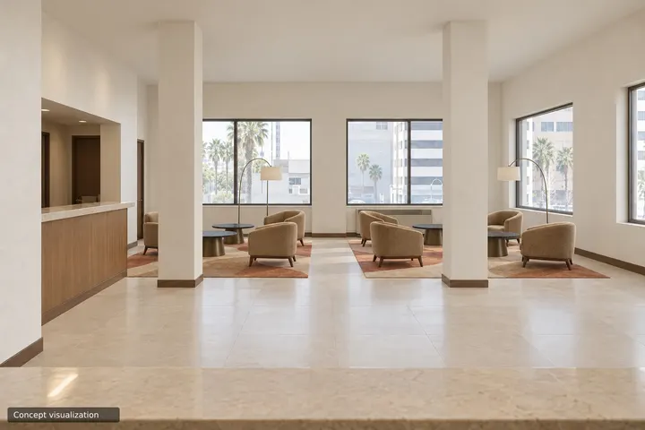 The same lobby from the same spot, restyled with the specified lounge chairs, tables and rugs on a stone floor, marked “Concept visualization”